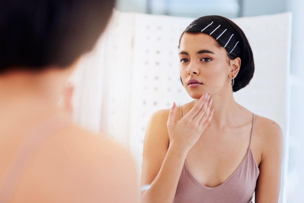 How to Know About Your Skin Type and Why It Matters 4 woman smiling with healthy glowing skin in a natural skincare portrait