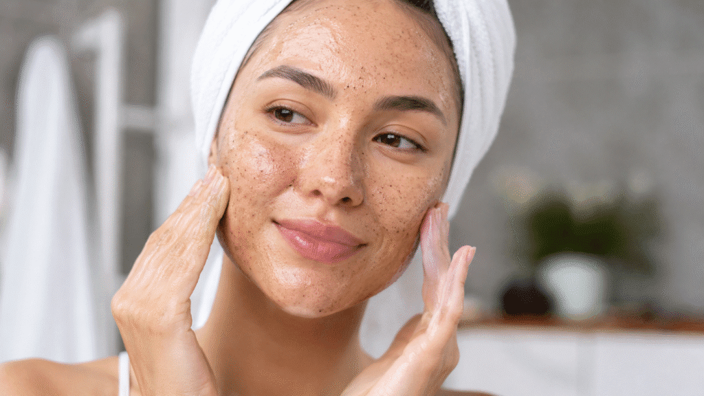 Woman gently exfoliating her face.