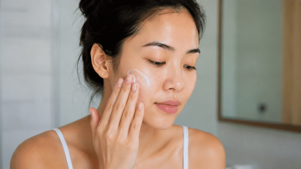 Photo of a girl applying moisturizer